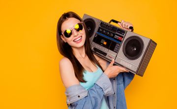 girl holding stereo